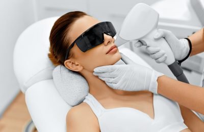 Face Care. Facial Laser Hair Removal. Beautician Giving Laser Epilation Treatment To Young Woman's Face At Beauty Clinic. Body Care. Hairless Smooth And Soft Skin. Health And Beauty Concept.